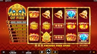 9 Masks of Fire slot with spinning reels showing flaming sevens, bells, and diamond wilds.