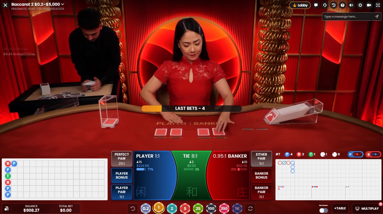 Live Baccarat 2 game with red theme and dealer dealing cards before round start. Live Baccarat 2 game with red theme and dealer dealing cards before round start.