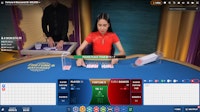 Live dealer Baccarat 6 layout displaying banker’s winning hand.