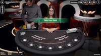 Blackjack Berlin table with dealer and hostess ready for players to take a seat.