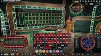 PowerUP Roulette live game interface with host standing beside roulette wheel.