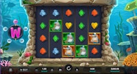 Shark Wash online slot gameplay screen with colorful coral tiles and animated scrubbing sharks.