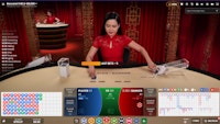  Live Baccarat 5 table with red theme and a live  dealer in action