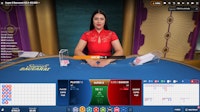 Super 8 Baccarat dealer hosting live game with bet interface and leaderboard display.